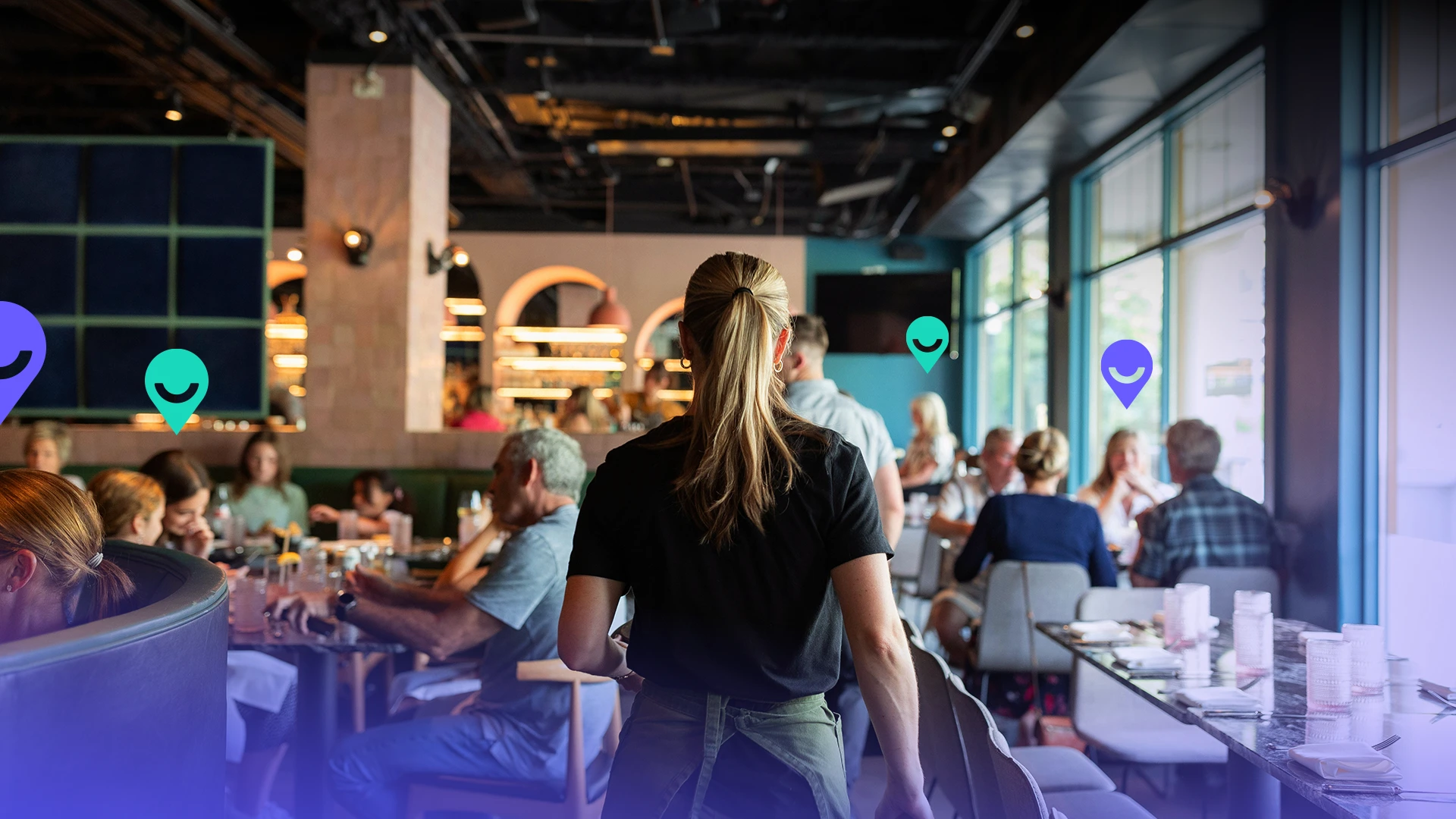 A Waitress Serving Food in a Busy Restaurant